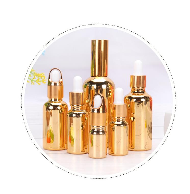 Essential oil bottle 50ml 100ml sets glass bottle with gold spray dropper cap empty cosmetic cuticle oil bottle