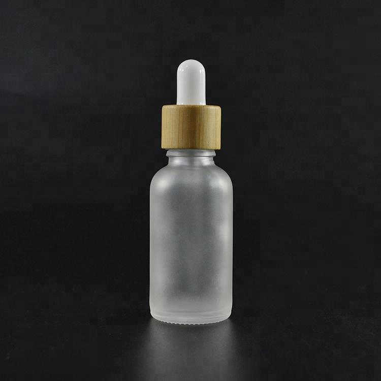 Essential oil cosmetic 10ml 15ml 20ml 30ml 1OZ 50ml 60ml 100ml frosted clear glass serum dropper bottle with bamboo dropper top