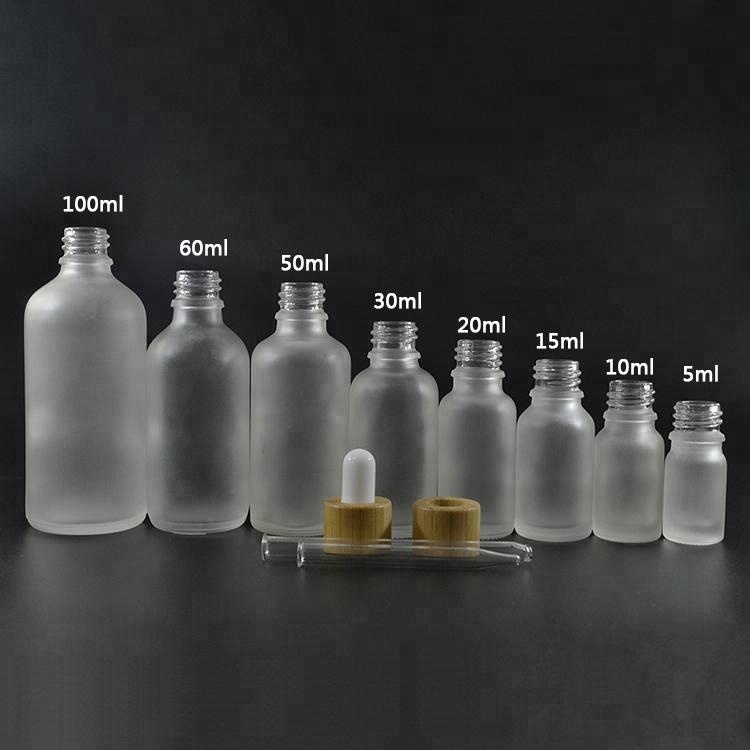 Essential oil cosmetic 10ml 15ml 20ml 30ml 1OZ 50ml 60ml 100ml frosted clear glass serum dropper bottle with bamboo dropper top