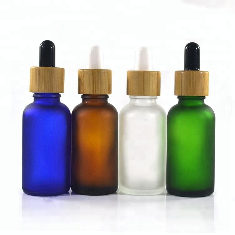 Essential oil cosmetic 10ml 15ml 20ml 30ml 1OZ 50ml 60ml 100ml frosted clear glass serum dropper bottle with bamboo dropper top