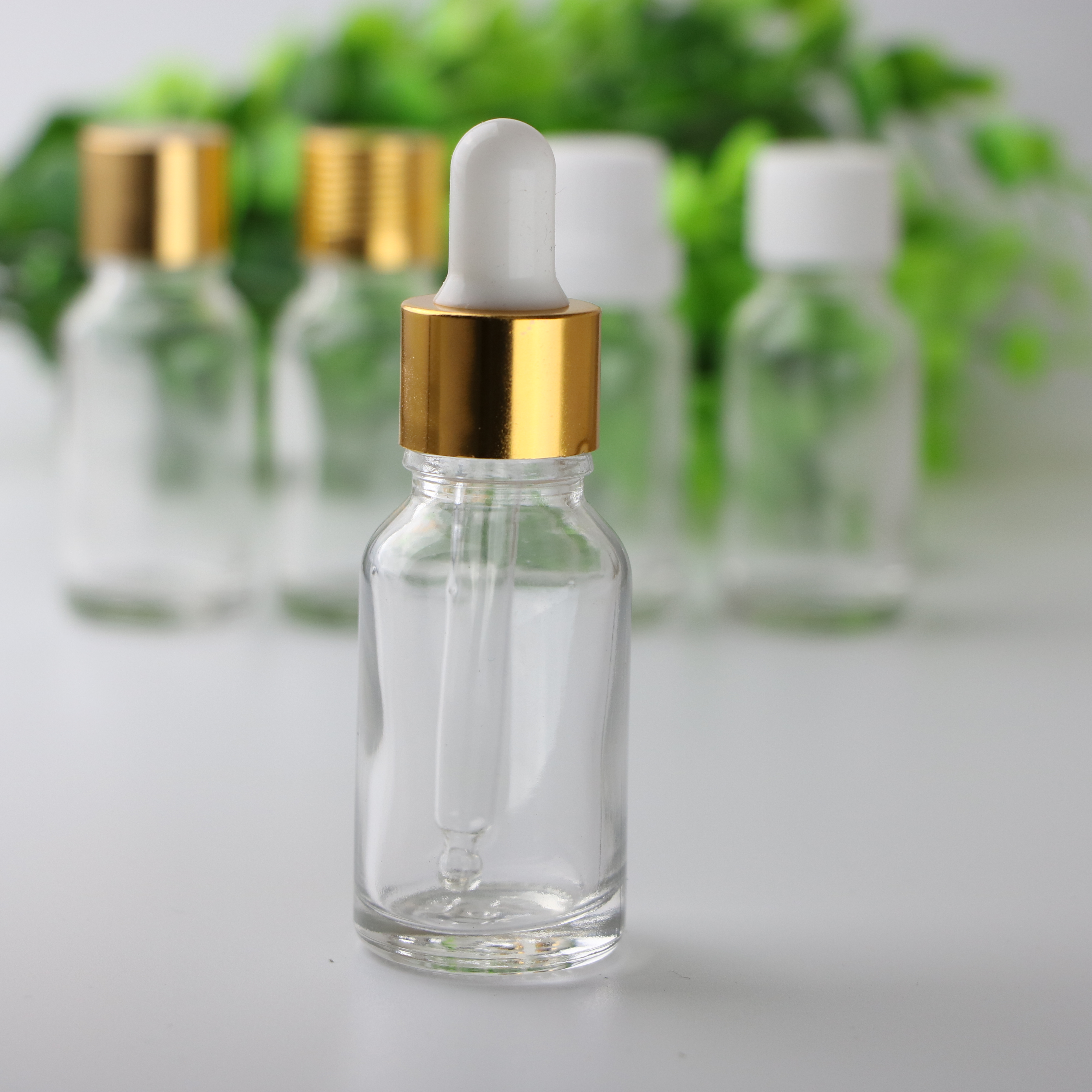 Essential oil packaging custom 5ml 10ml 15ml 20ml 30ml 50ml100ml clear green blue amber glass dropper bottle with childproof cap