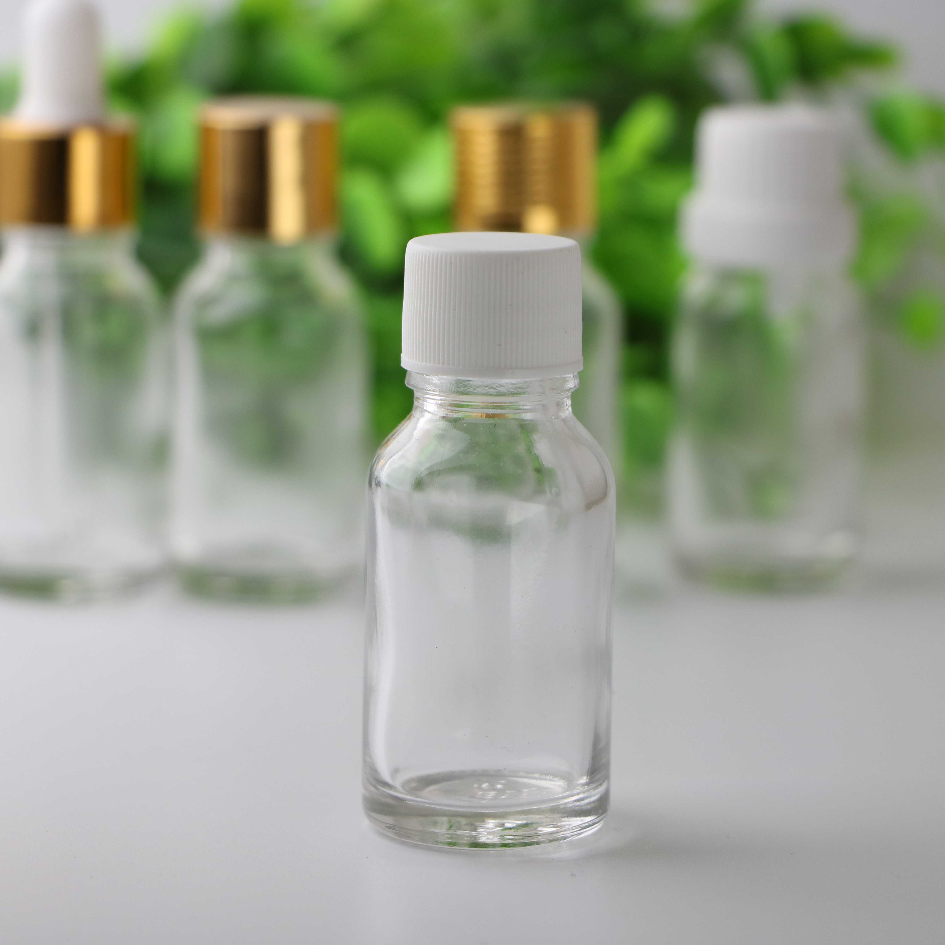 Essential oil packaging custom 5ml 10ml 15ml 20ml 30ml 50ml100ml clear green blue amber glass dropper bottle with childproof cap