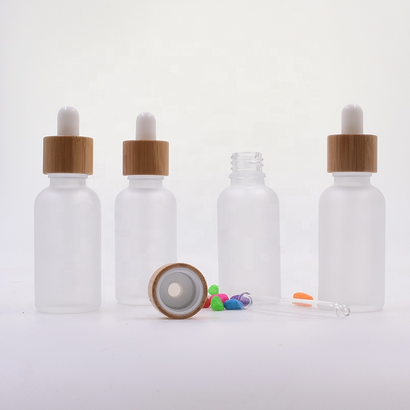 Factory 1oz clear frosted round weed packaging medical oil rosins waxes cbd hanf knosp glass bottles with bamboo pump dropper