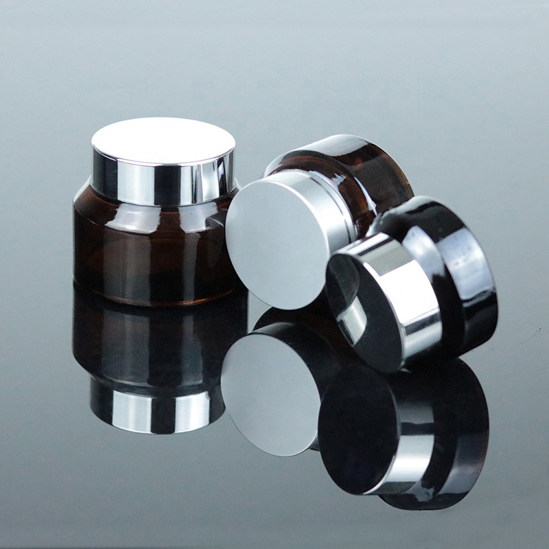 Factory Price 2 oz 60ml Clear Round Bottom Cosmetic Glass Jar with Black Lid (GJM45)