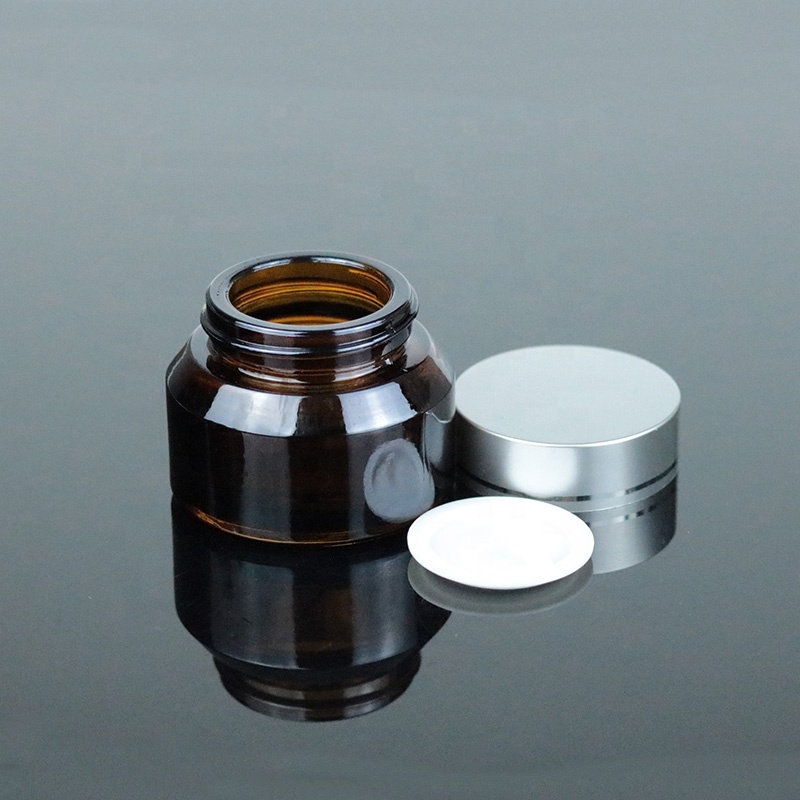 Factory Price 2 oz 60ml Clear Round Bottom Cosmetic Glass Jar with Black Lid (GJM45)