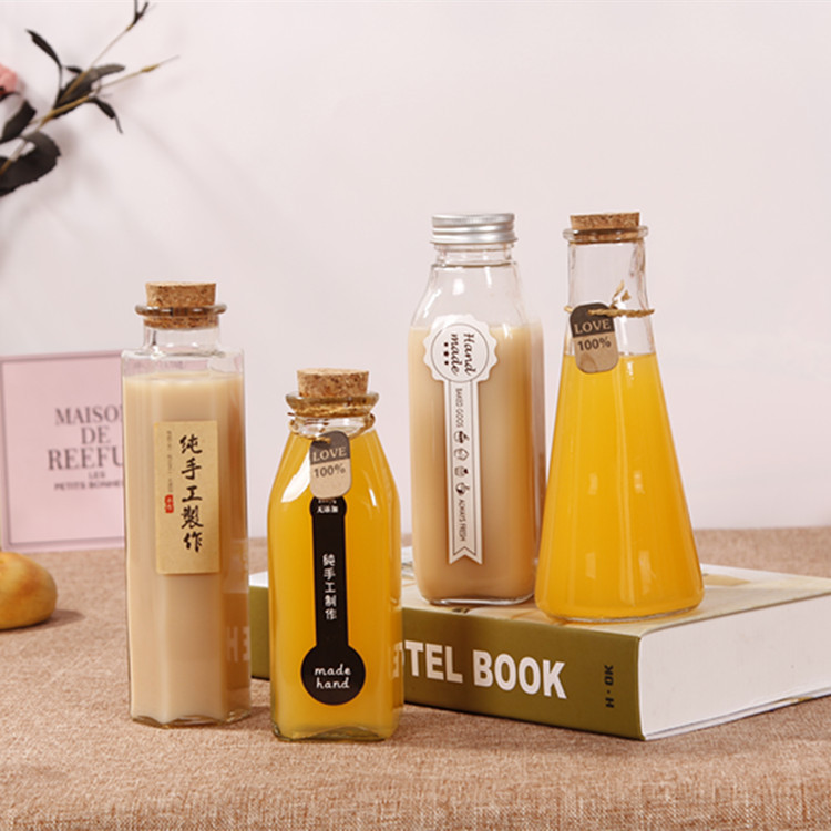 Factory direct custom beverage packaging bottle glass 100ml 150ml 350ml cork cap seal transparent milk juice bottle