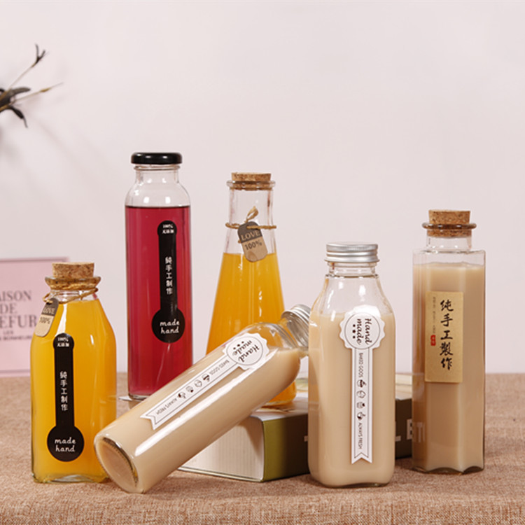 Factory direct custom beverage packaging bottle glass 100ml 150ml 350ml cork cap seal transparent milk juice bottle