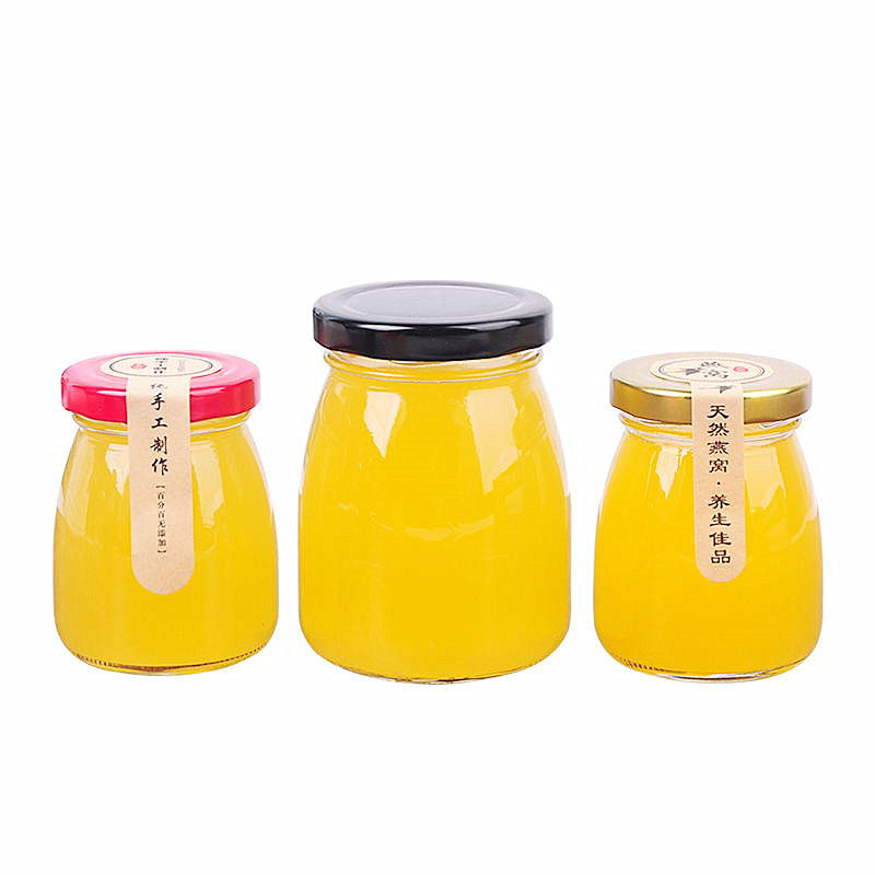 Factory direct sale glass patch bird's nest with lid empty honey bottle