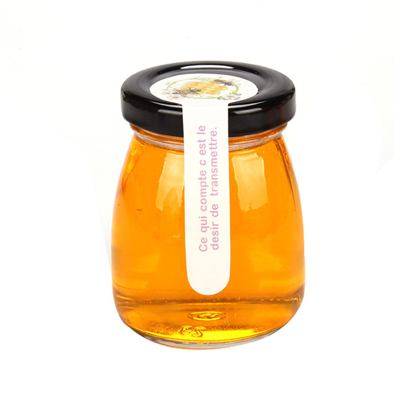 Factory direct sale glass patch bird's nest with lid empty honey bottle