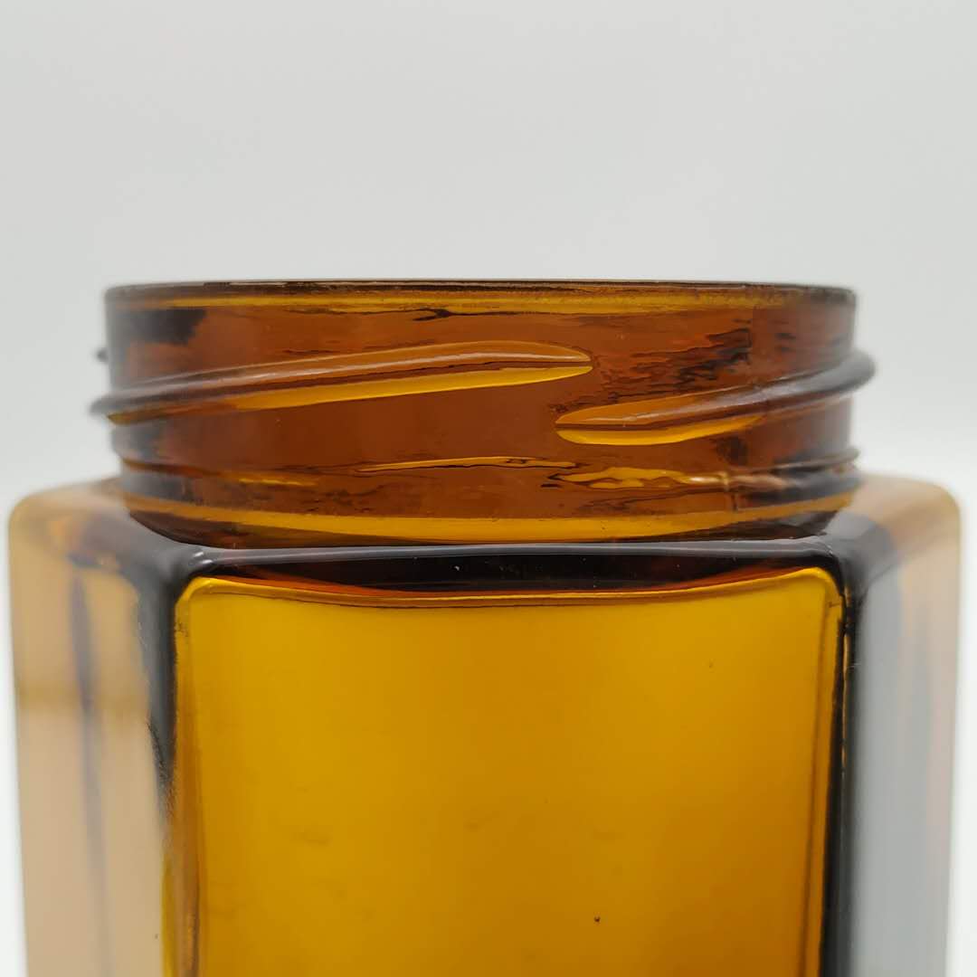 Factory direct sale hexagonal glass honey jar with metal lid 280 ml