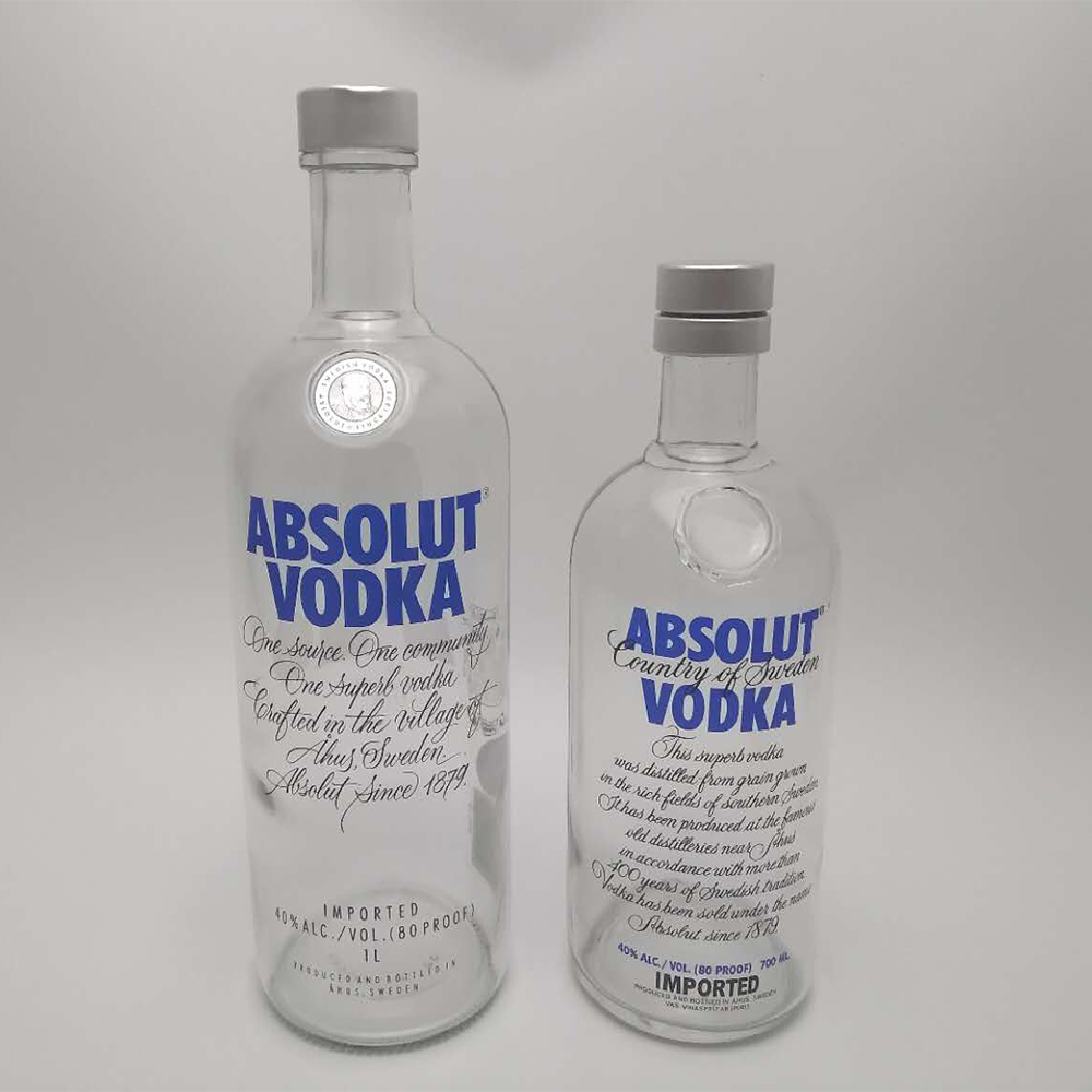 Factory direct sales custom 700ml 1000ml absolut vodka spirit glass bottle with silver screw guala closures