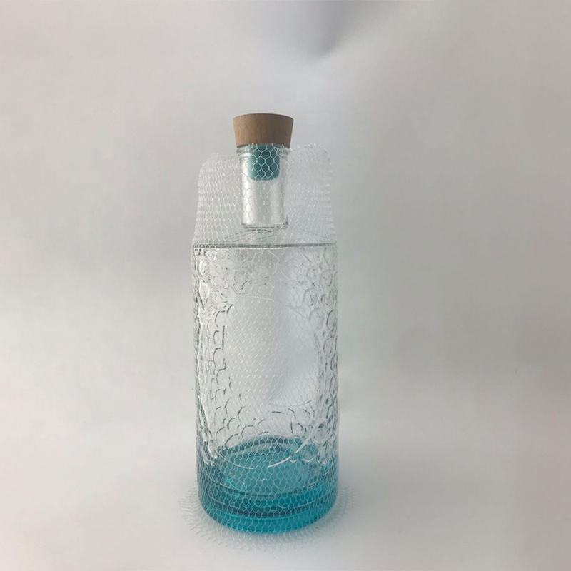 Factory direct sales embossed blue turtle 700ml glass gin bottle in gradient color paint