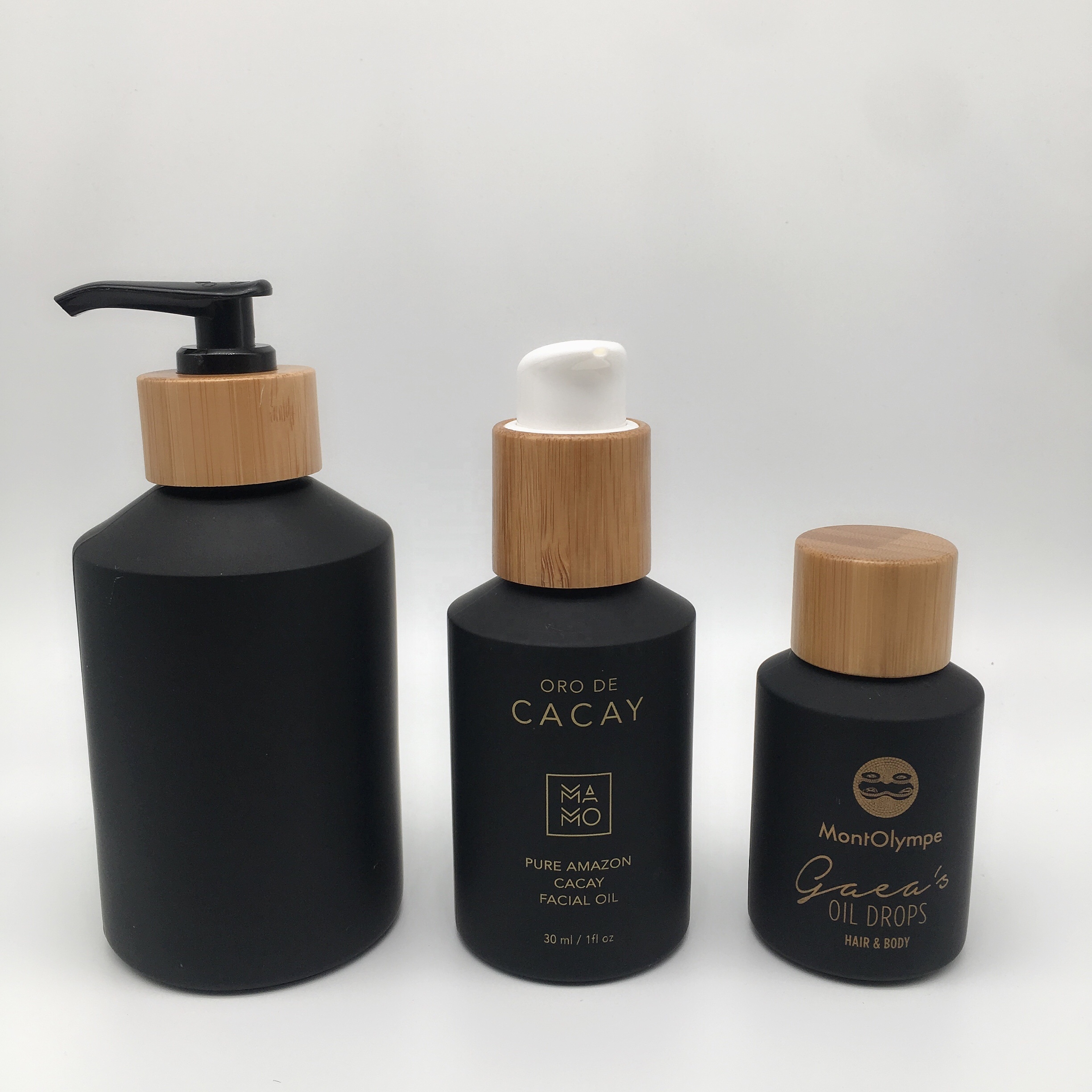 Factory hot sell cosmetic packaging frosted black glass bottle and jar with bamboo lid