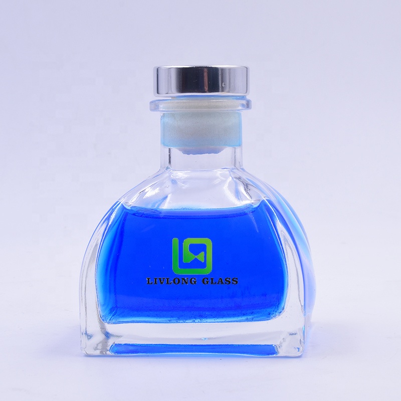 Factory-price 200 ml clear ger shape perfume aromatherapy glass bottle with cork