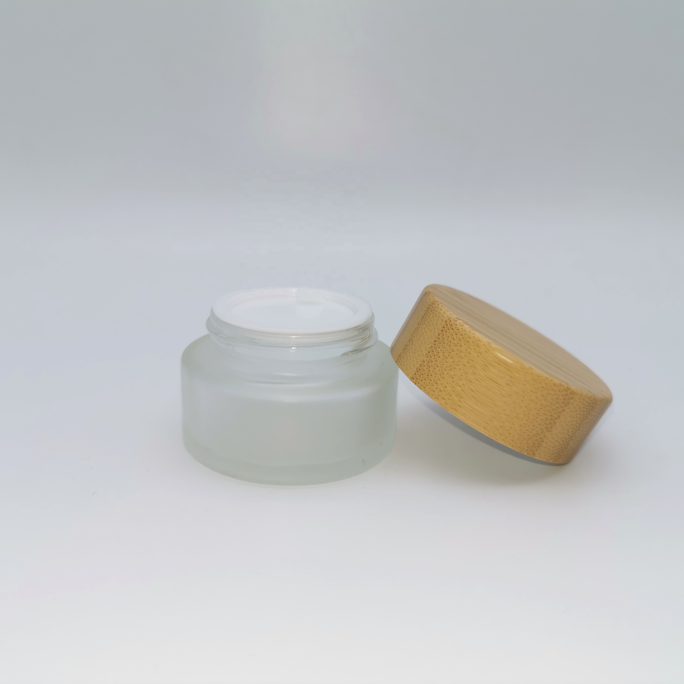 Factory price cosmetic containers frosted cream glass jar with bamboo lid