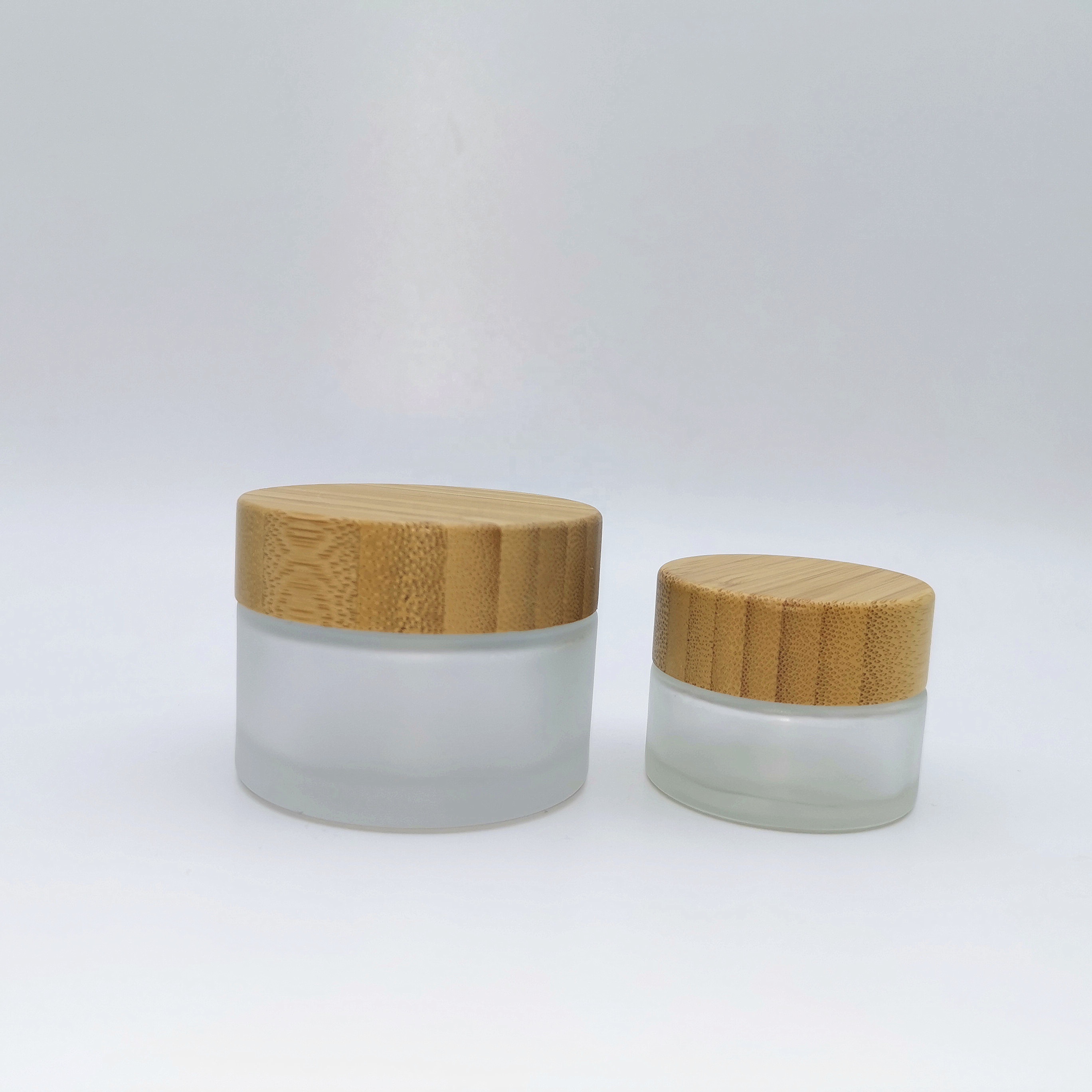 Factory price cosmetic containers frosted cream glass jar with bamboo lid