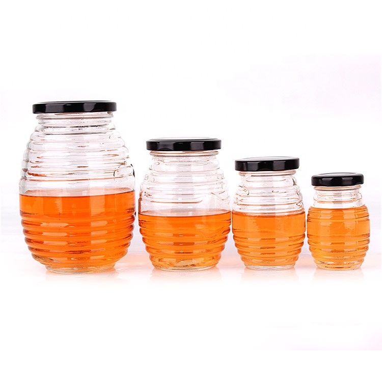 Factory sell stock empty 100ml bee honey glass jar for storage with metal twist off cap