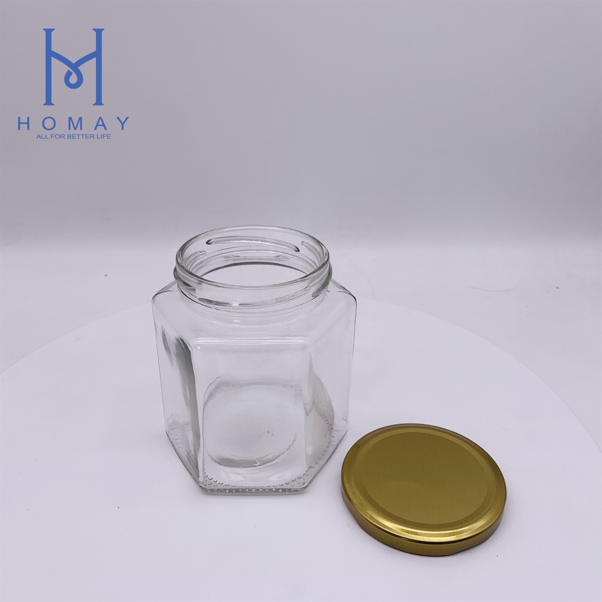 Factory selling 500ml hexagonal glass food storage jar with cap