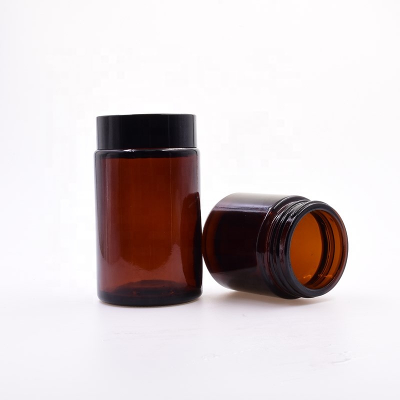 Factory smooth primary color amber round 100ml 120ml 180ml glass bottle sauce empty flower packaging glass jar with pp black lid