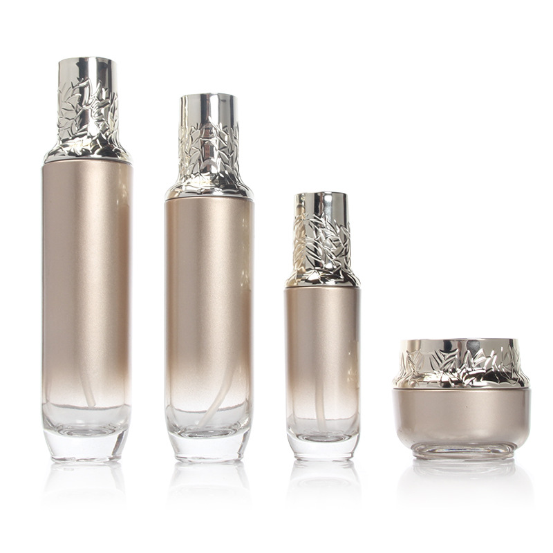 Factory supply new design 120ml 100ml 40ml 50g golden glass bottles and jars with carved cap cosmetic container package
