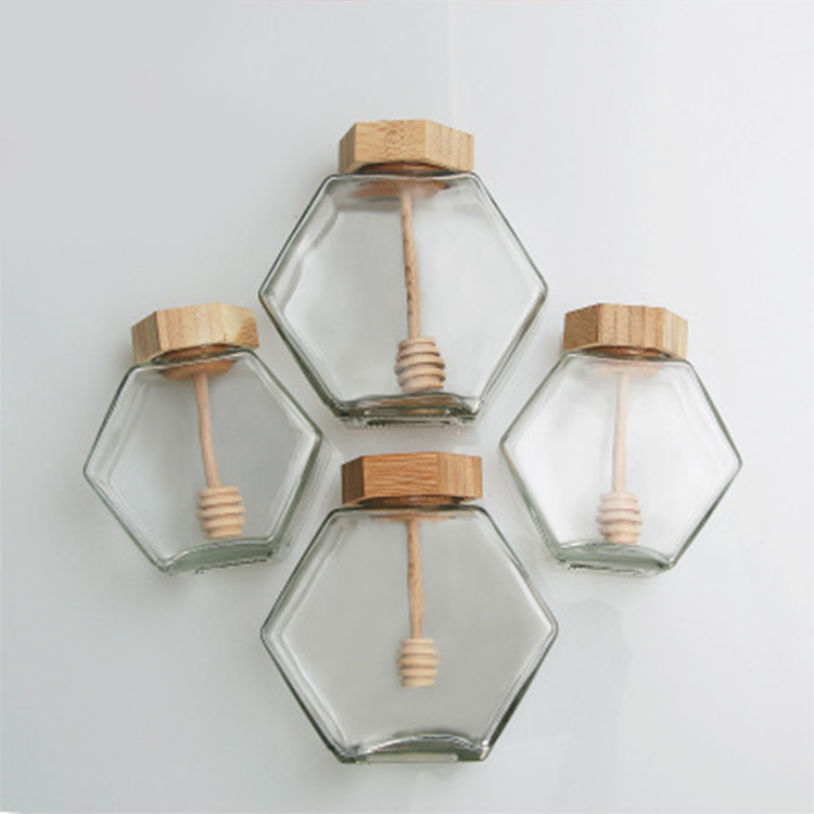 Factory wholesale Hexagonal Shaped Glass Honey bee storage Jar 220ml 380ml with Wooden Dipper and Bamboo Lid