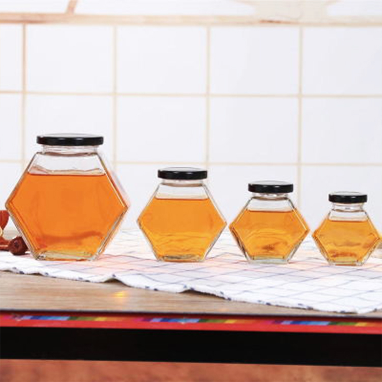 Factory wholesale Hexagonal Shaped Glass Honey bee storage Jar 220ml 380ml with Wooden Dipper and Bamboo Lid