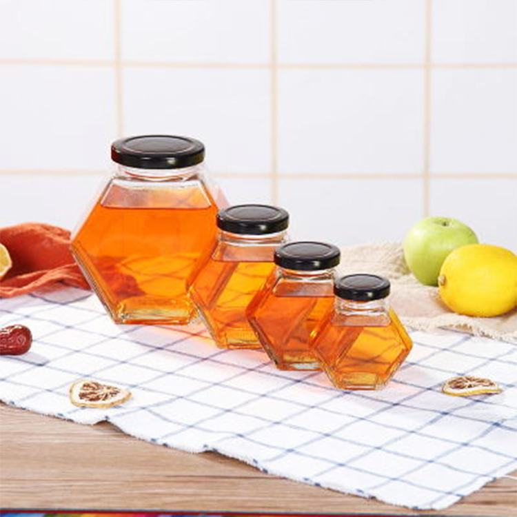 Factory wholesale Hexagonal Shaped Glass Honey bee storage Jar 220ml 380ml with Wooden Dipper and Bamboo Lid