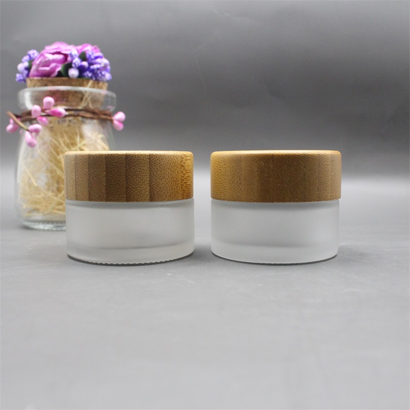 Factory wholesale cosmetic bamboo jar clear frosted glass cream jar 100% nature bamboo wooden lid envases