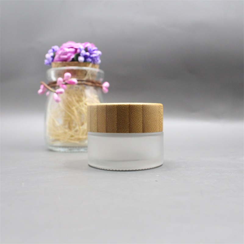 Factory wholesale cosmetic bamboo jar clear frosted glass cream jar 100% nature bamboo wooden lid envases
