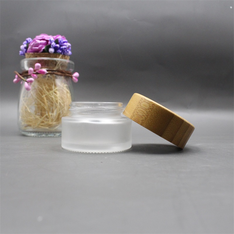 Factory wholesale cosmetic bamboo jar clear frosted glass cream jar 100% nature bamboo wooden lid envases