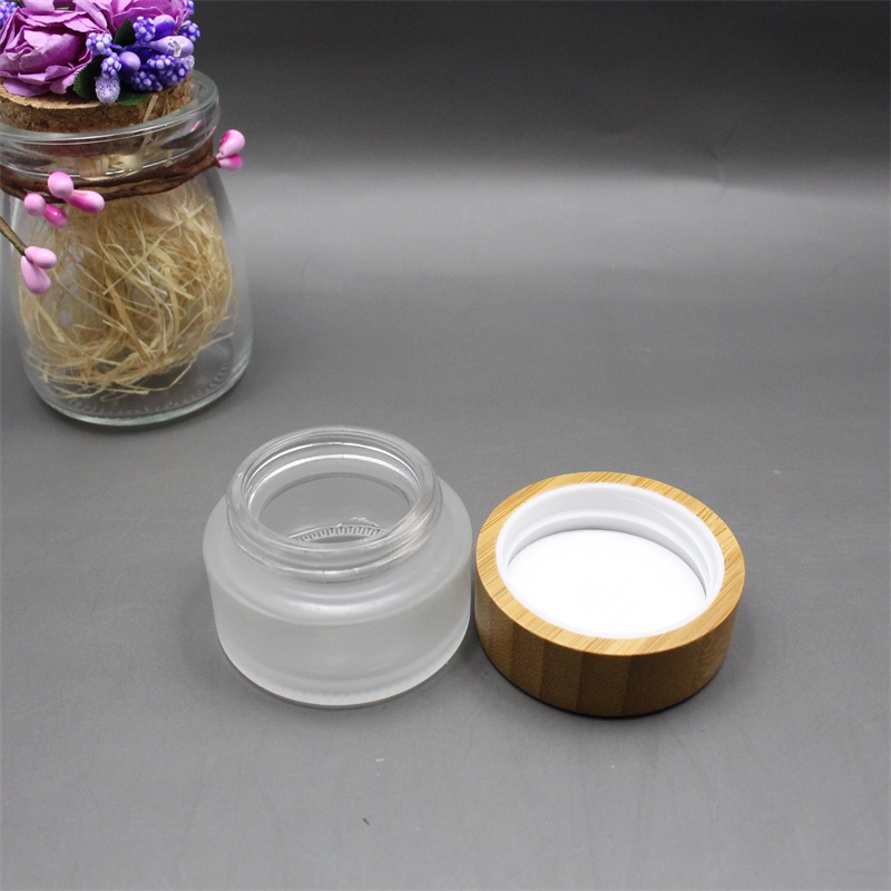 Factory wholesale cosmetic bamboo jar clear frosted glass cream jar 100% nature bamboo wooden lid envases