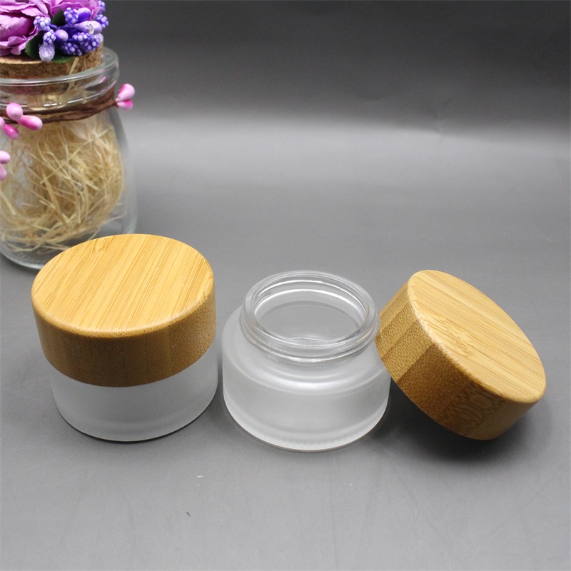 Factory wholesale cosmetic bamboo jar clear frosted glass cream jar 100% nature bamboo wooden lid envases