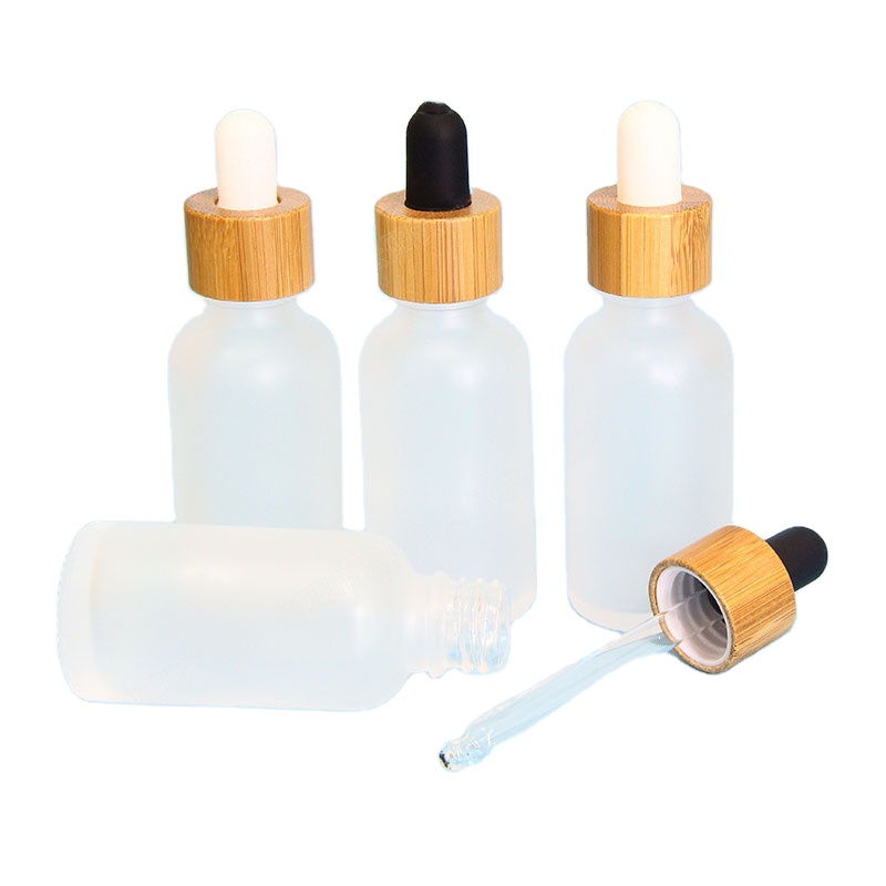 Fancy clear amber green blue color 5ml 10ml 15ml 20ml 30ml 50ml 100ml round glass essential oil dropper bottle with bamboo neck