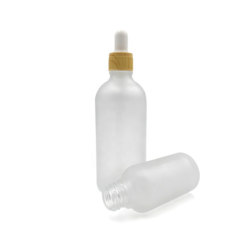 Fancy clear amber green blue color 5ml 10ml 15ml 20ml 30ml 50ml 100ml round glass essential oil dropper bottle with bamboo neck