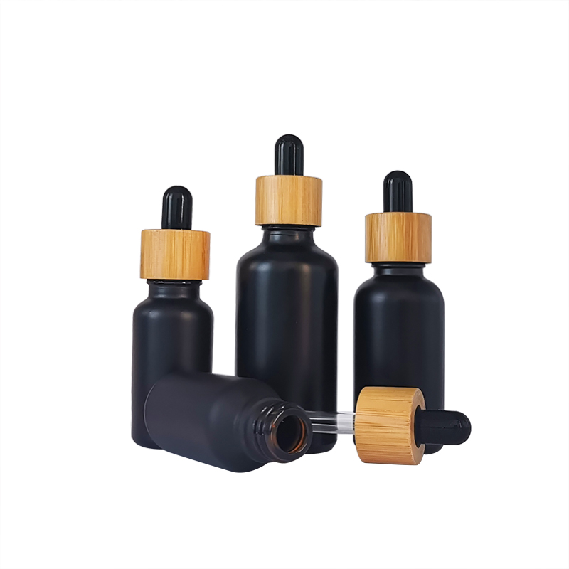 Fancy clear amber green blue color 5ml 10ml 15ml 20ml 30ml 50ml 100ml round glass essential oil dropper bottle with bamboo neck