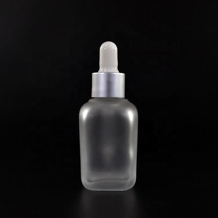 Fancy square 15ml 20ml 30ml 50ml 100ml 30 ml clear frosted clear perfume glass dropper bottle with gold hollow caps
