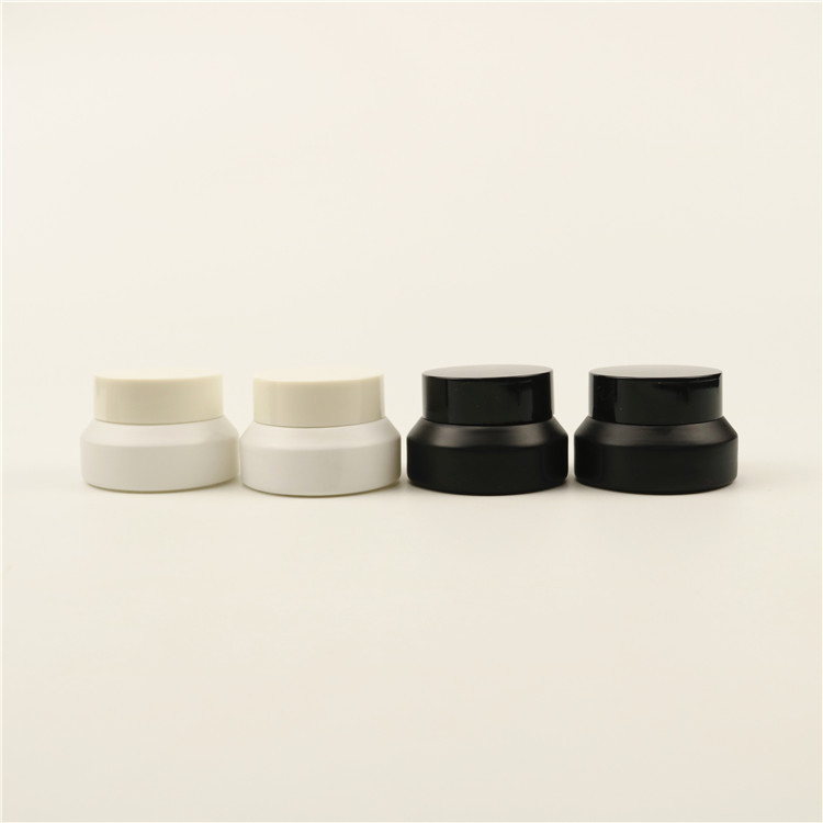 Flat concentrate/cream cylinder slant shoulder black matt ,white, clear ,olive green blue glass cream jar with plastic lid