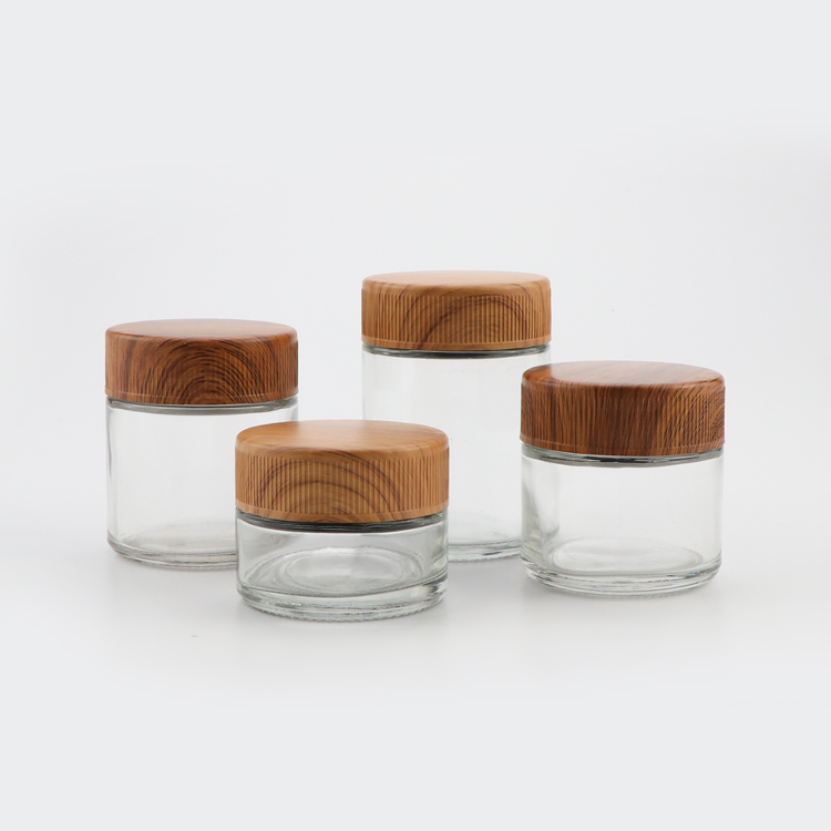 Food grade 1oz 2oz 3oz 4oz transparent candy containers round nuts storage thick glass canister jar with wood lid