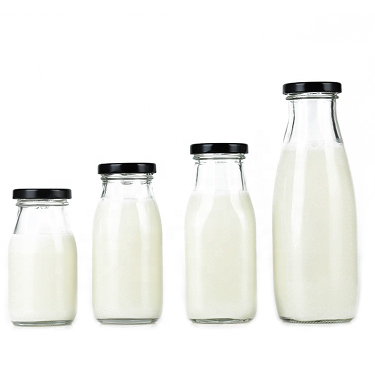 Food grade Clear 250ml round glass bottles with metal lid for cold pressed milk tea juice