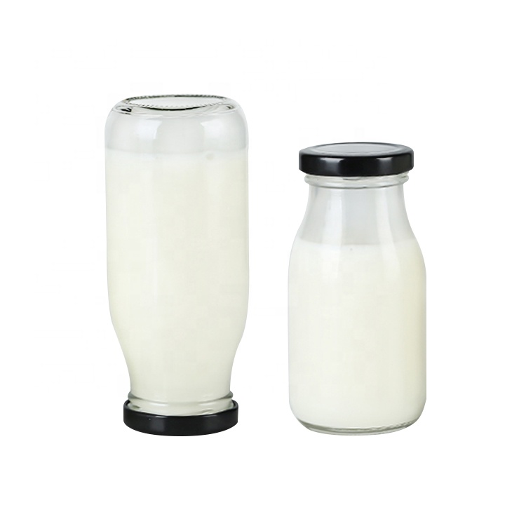 Food grade Clear 250ml round glass bottles with metal lid for cold pressed milk tea juice