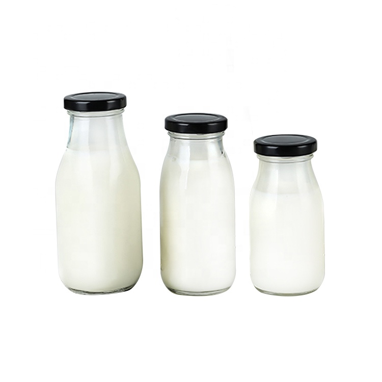 Food grade Clear 250ml round glass bottles with metal lid for cold pressed milk tea juice
