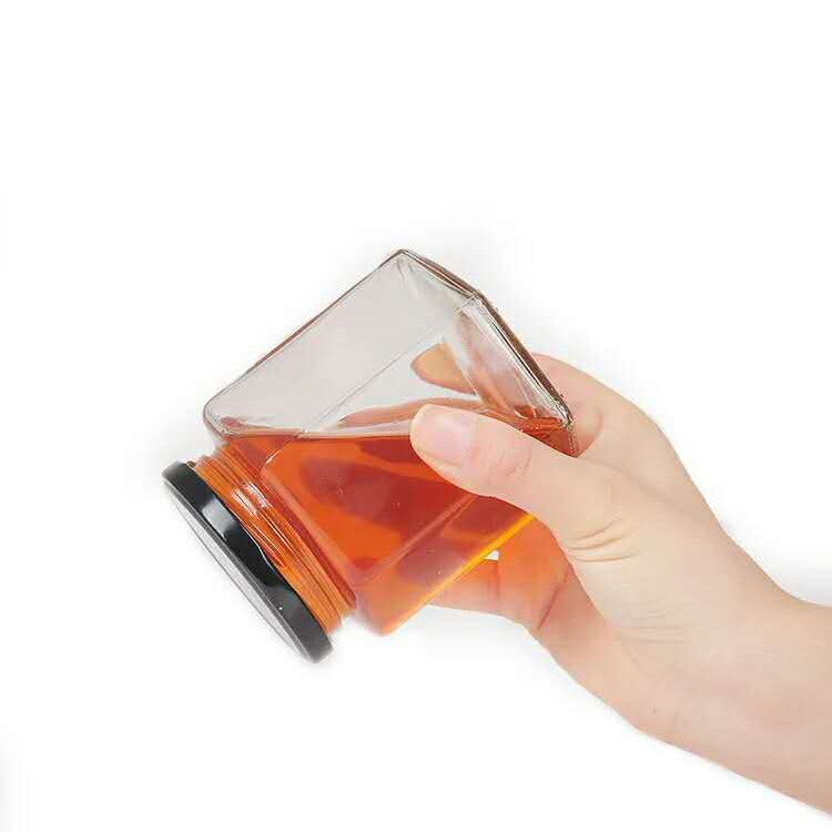 Food grade hexagonal clear 45ml to 730ml glass storage jar with metal lid for honey coffee bean grains candy