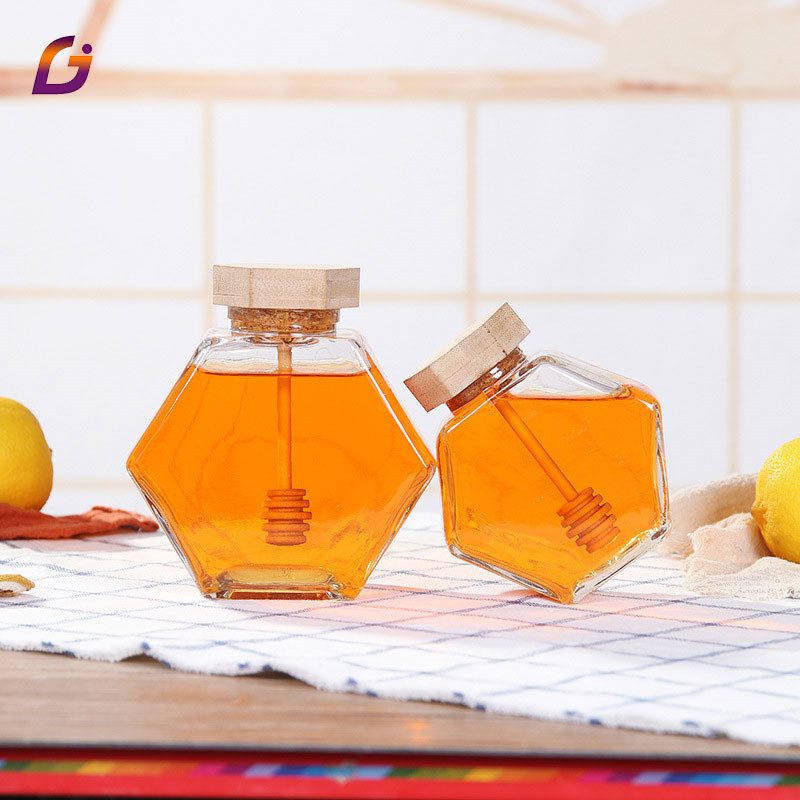 Food packaging 100ml small hexagonal glass honey jar with wooden dipper