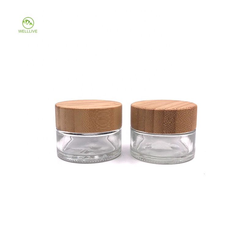 Free sample 30g 50g 1 oz clear glass empty jar with bamboo screw top lid for anointing oil