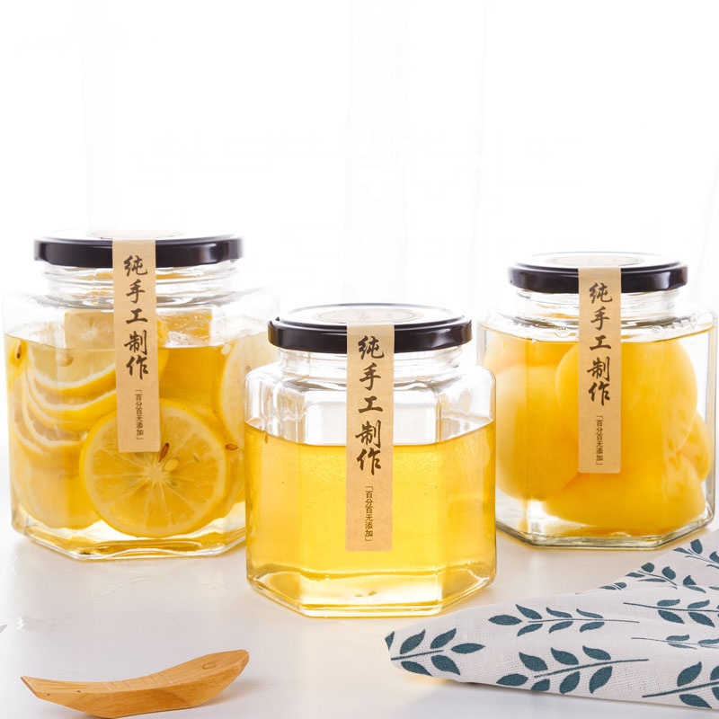 Free sample cheap hexagon honey jars, hexagon glass jar 50ml 180ml 380ml 500ml with black lids food jar