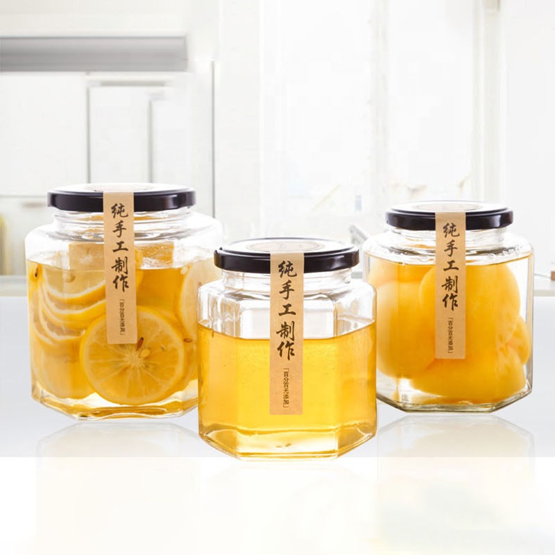 Free sample cheap hexagon honey jars, hexagon glass jar 50ml 180ml 380ml 500ml with black lids food jar