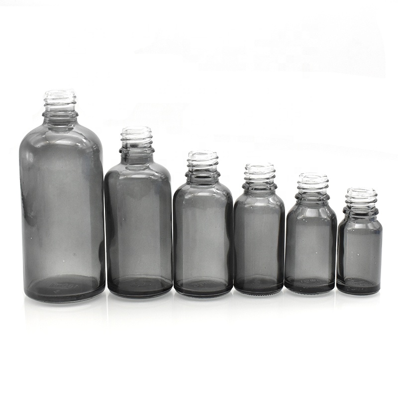 Free sample printed glass bottle pink blue black 30ml dropper glass essential oil bottle 50ml 100ml 15ml 10ml with plastic lids