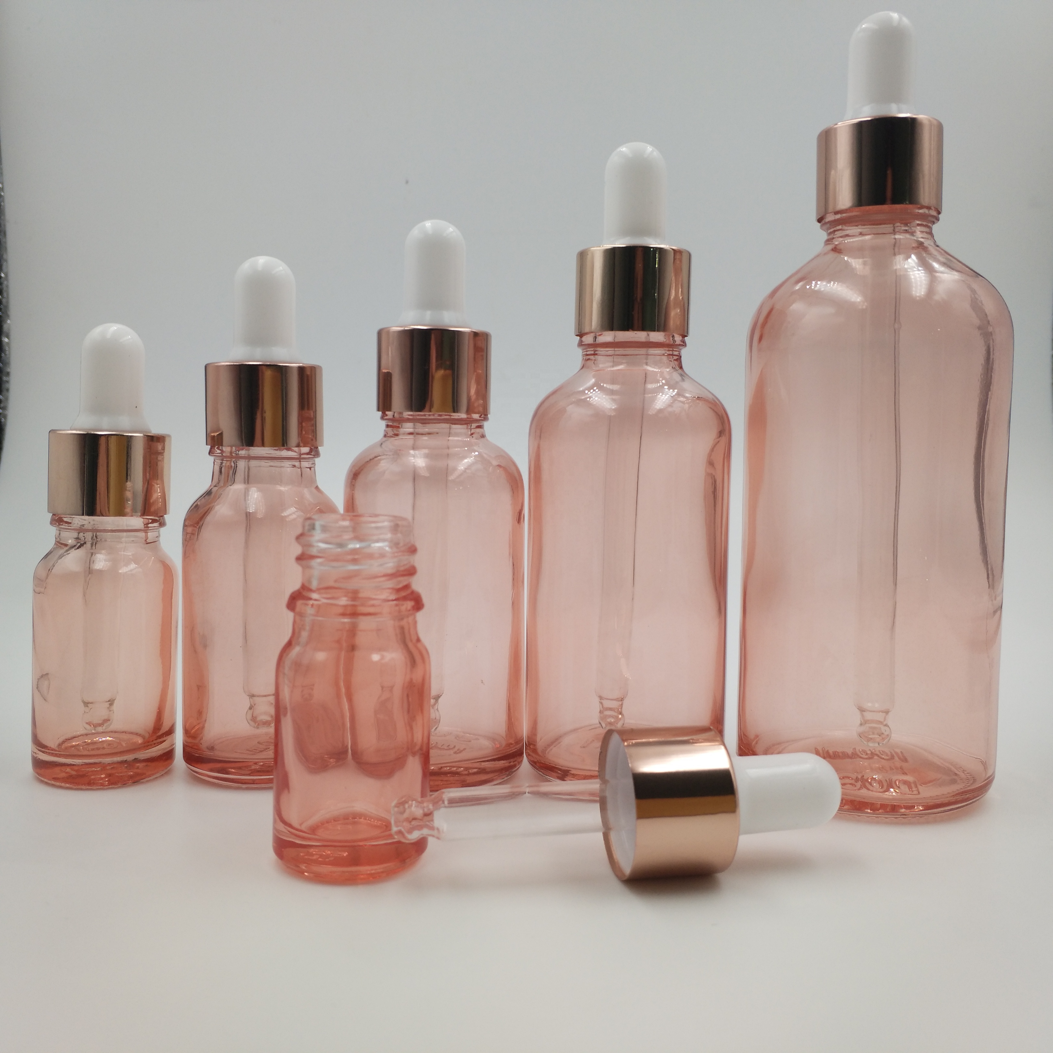 Free samples 5ml 10ml 15ml 20ml 30ml 50ml 100ml frosted clear glass essential oil dropper bottle with rose gold lid
