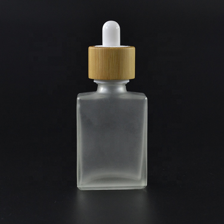 Free samples essential oil empty frosted clear bamboo lid 30ml 50ml 100ml 1oz rectangle glass bottle