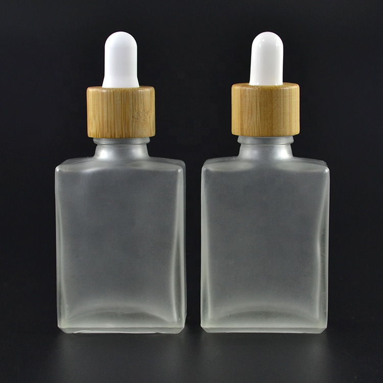 Free samples essential oil empty frosted clear bamboo lid 30ml 50ml 100ml 1oz rectangle glass bottle